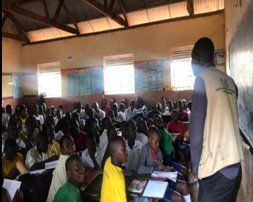 PHIC staff conducting IEC session on 25th April 2024 At Gombe Kayunga primary school