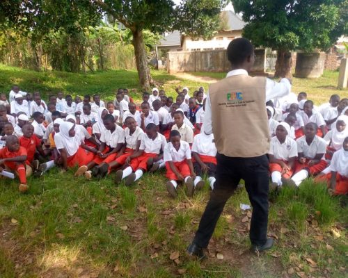 PHIC staff and pupils of group photo after conducting IEC session on 12th April 2024 At Namusera Umea primary school